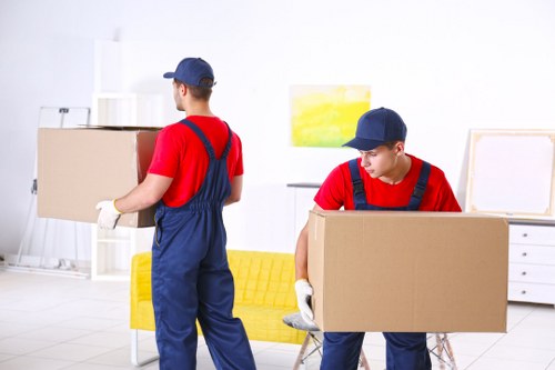 Professional house removalists loading furniture in Kingston upon Thames