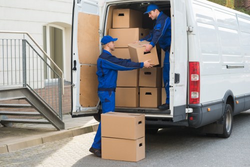 Professional van moving team following safety procedures