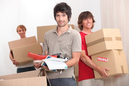 Risk assessment scene with movers checking access and planning a safe move