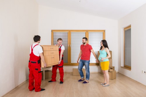 Packed moving boxes and furniture for a local house move