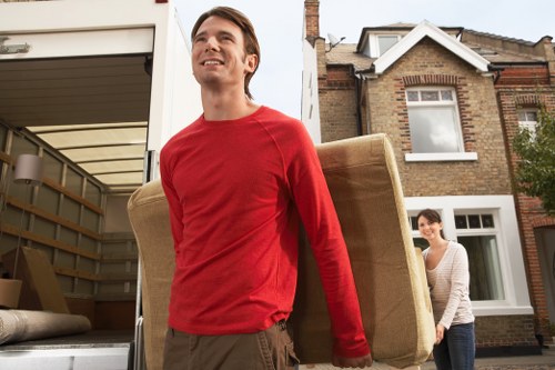 Local van loading household furniture for a Kingston move