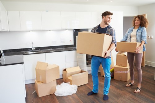 Staff member using PPE during a house move
