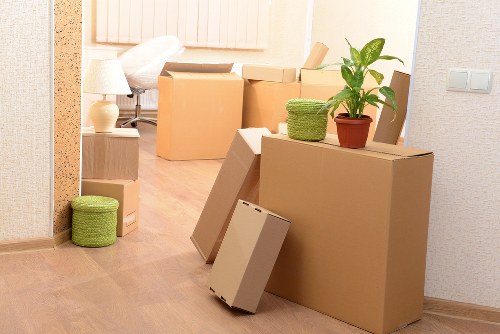 Professional movers loading furniture into a van in Kingston upon Thames