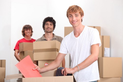 Labelled office boxes and furniture for a commercial move in Kingstonuponthames